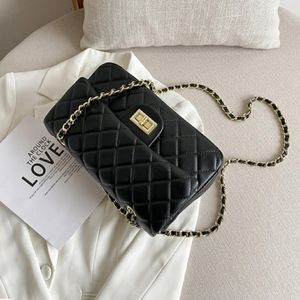 BLACK HAND BAG WITH GOLD CHAIN STRAPS AND BUCKLE.(KELOLA D) BRAND